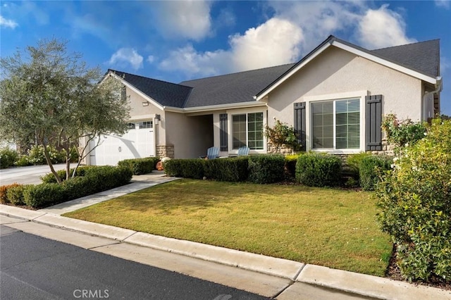 single story home with a garage and a front lawn