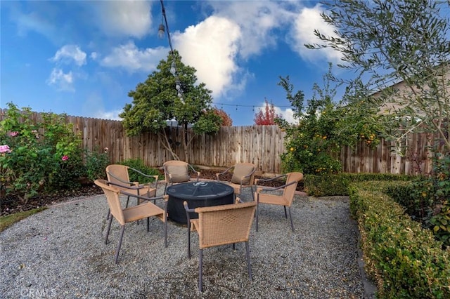 view of patio / terrace featuring an outdoor fire pit