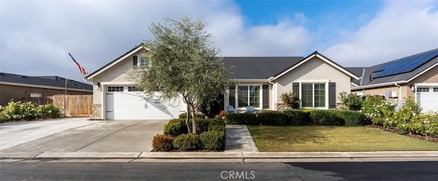 view of front of property featuring a garage and a front yard