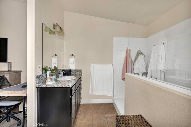 bathroom featuring vanity, tile patterned floors, walk in shower, and lofted ceiling