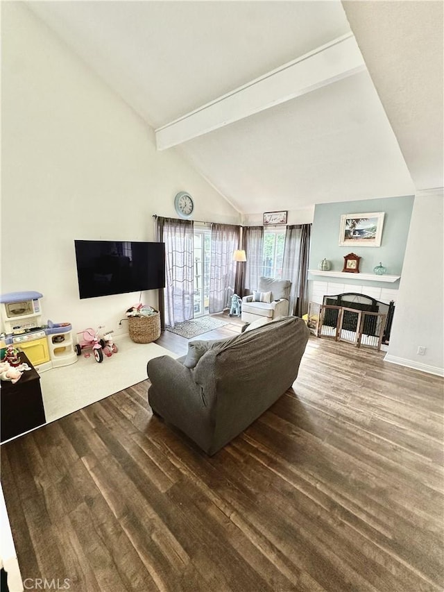 living room featuring hardwood / wood-style floors and vaulted ceiling with beams