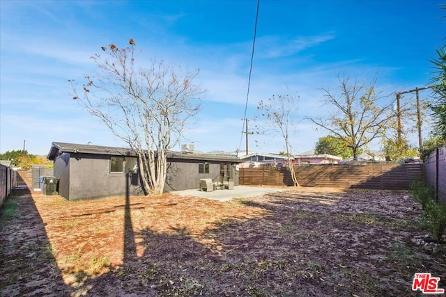 back of property featuring a patio