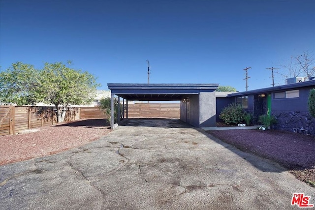 exterior space with a carport