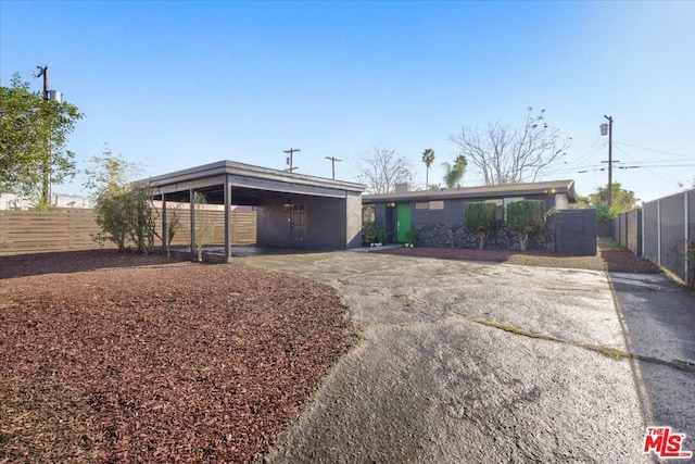 ranch-style home with a carport