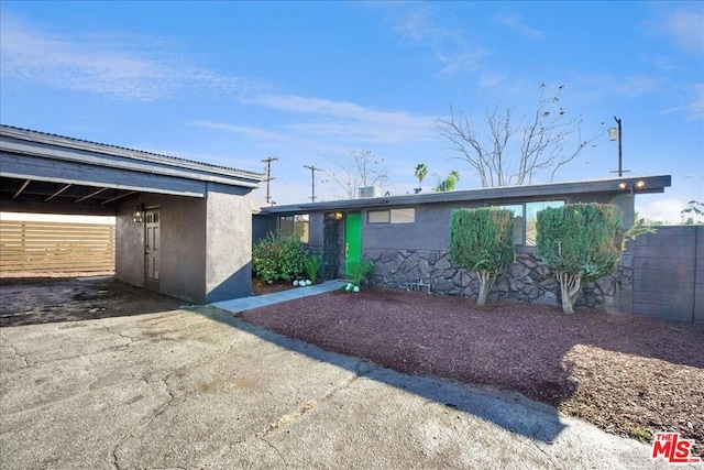 exterior space with a carport