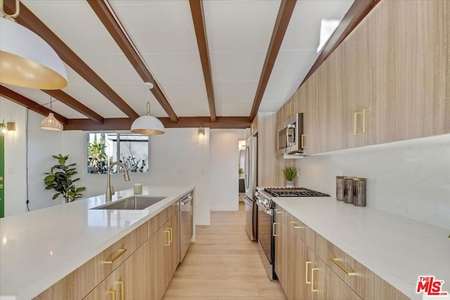 kitchen with beam ceiling, sink, light brown cabinets, stainless steel appliances, and decorative light fixtures