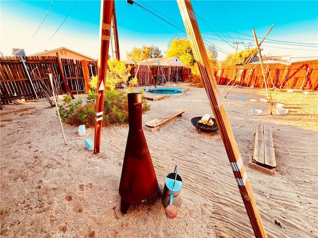 view of playground with a fenced backyard