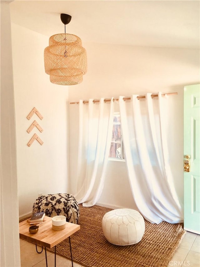 living area with tile patterned floors