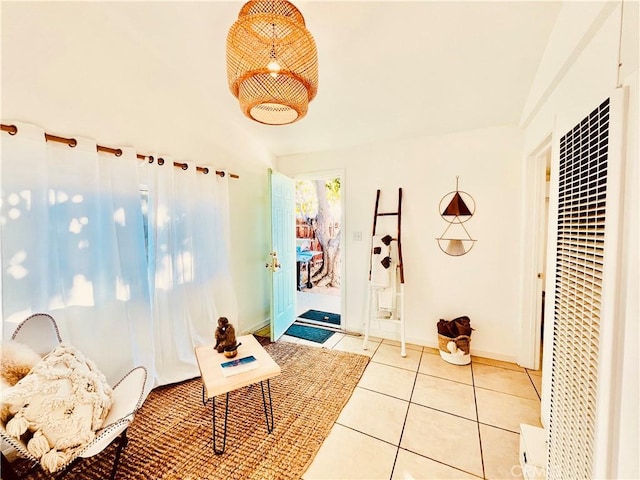 hallway featuring light tile patterned floors and a heating unit