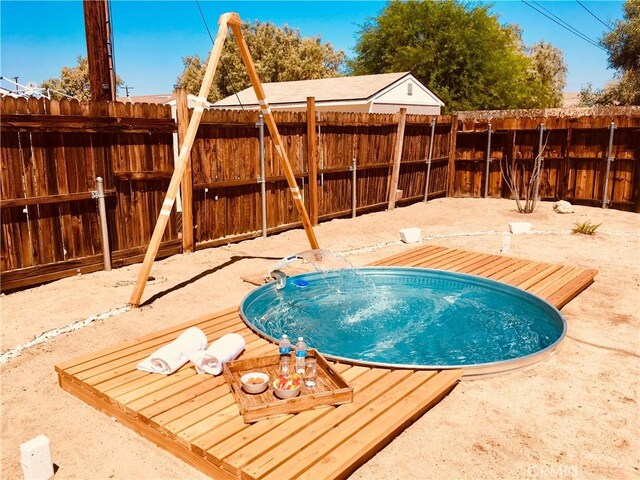 view of pool featuring a fenced backyard