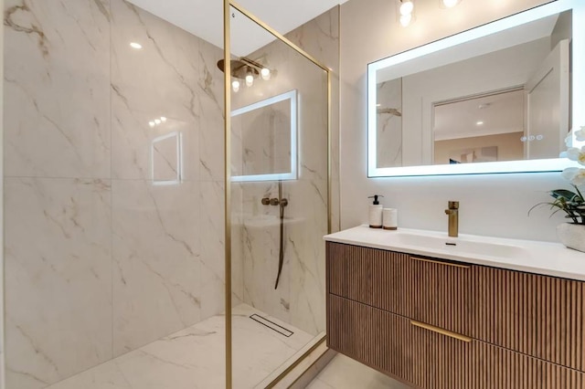 bathroom with vanity and a tile shower