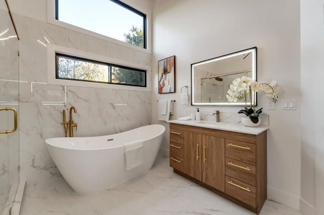 bathroom featuring vanity, independent shower and bath, and a high ceiling