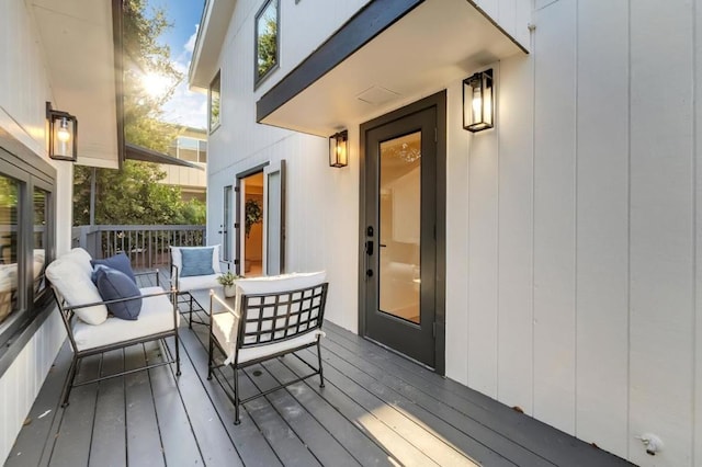 wooden deck featuring outdoor lounge area