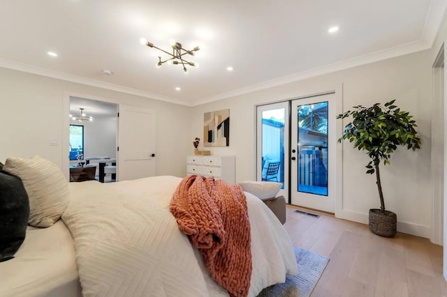 bedroom featuring crown molding, access to outside, a notable chandelier, and light hardwood / wood-style floors