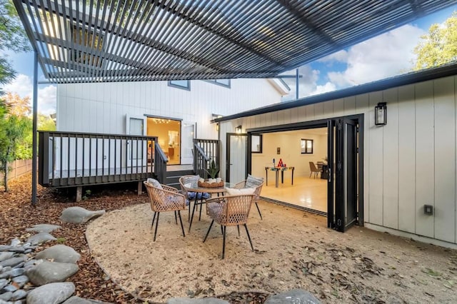 view of patio / terrace with a pergola and a deck