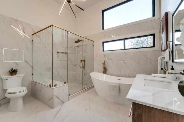 full bathroom featuring vanity, shower with separate bathtub, a notable chandelier, and toilet