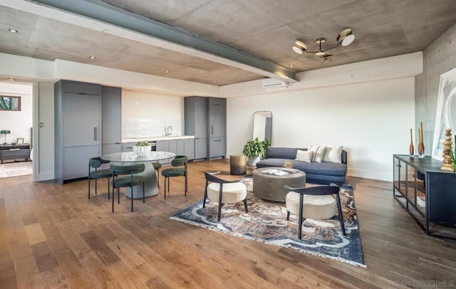 living room with sink and dark wood-type flooring