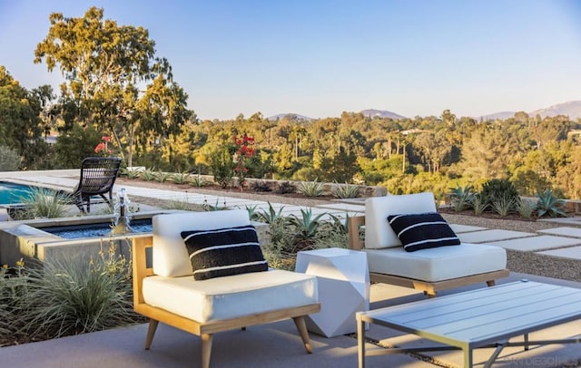 view of patio featuring a mountain view and an outdoor hangout area