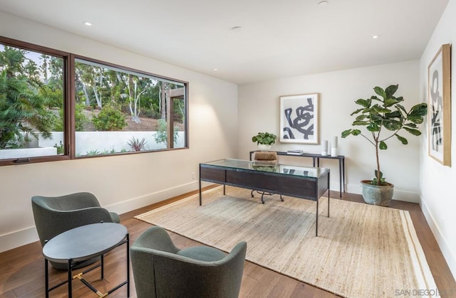 office with dark wood-type flooring