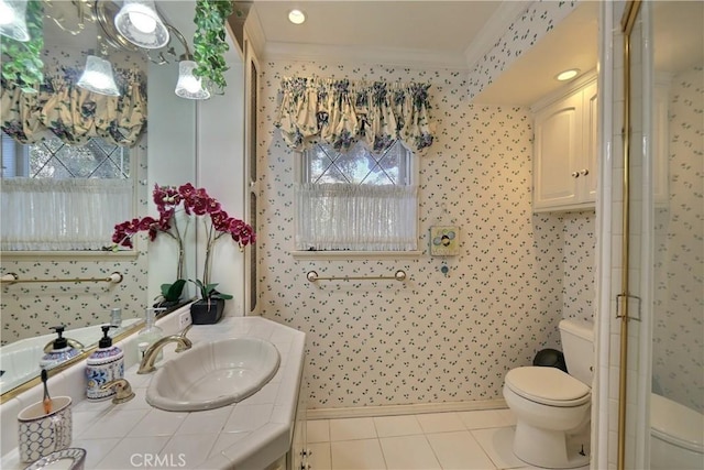 bathroom featuring tile patterned floors, vanity, toilet, and crown molding