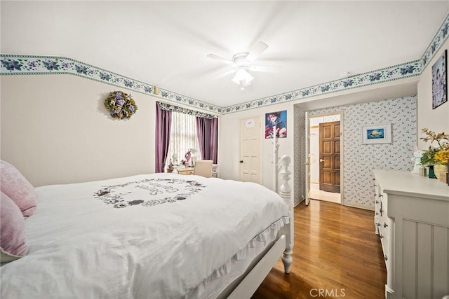 bedroom featuring hardwood / wood-style floors and ceiling fan