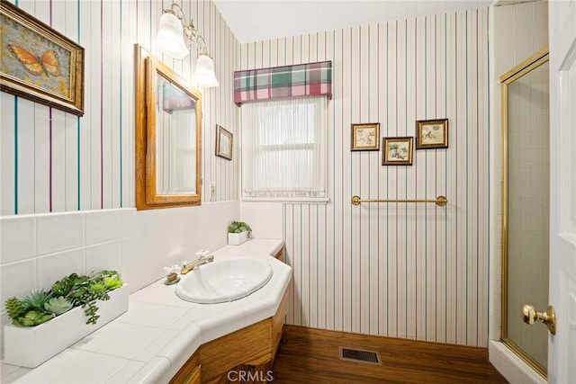 bathroom with vanity and an enclosed shower