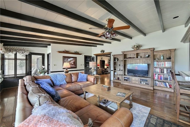 living room featuring beam ceiling, ceiling fan, and dark wood-type flooring