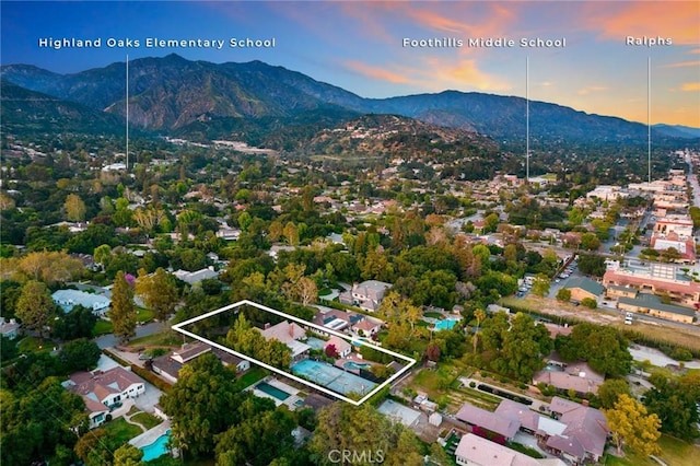 aerial view at dusk with a mountain view