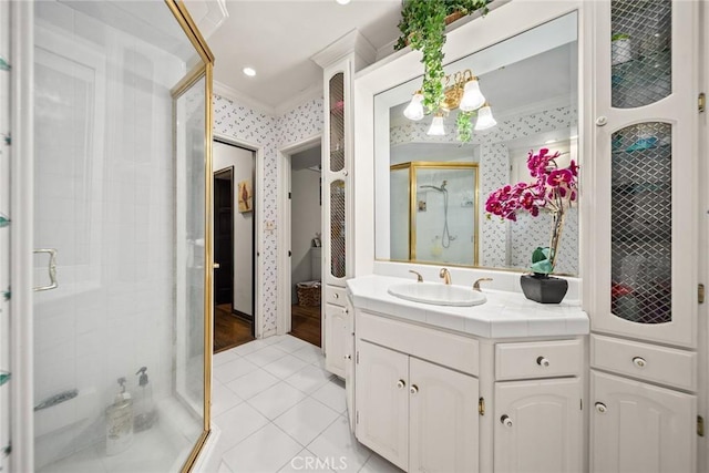 bathroom with vanity, tile patterned floors, walk in shower, and crown molding