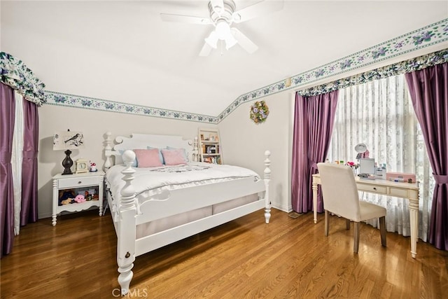 bedroom featuring hardwood / wood-style flooring, ceiling fan, and vaulted ceiling