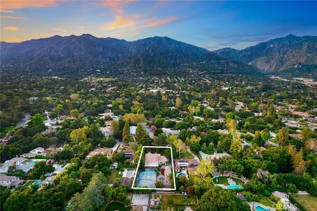 aerial view at dusk with a mountain view