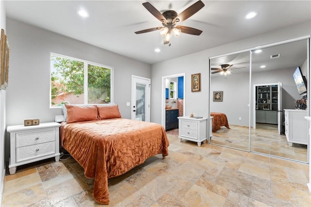 bedroom featuring ceiling fan and a closet