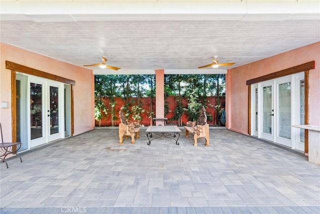 view of patio featuring ceiling fan and french doors