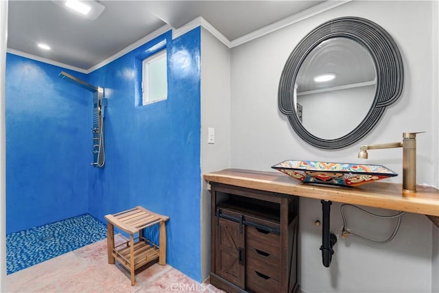 bathroom featuring sink and ornamental molding