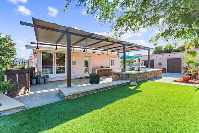 11431 Clybourn Ave, Lakeview Terrace, CA 91342 - back of property with a yard, a patio area, area for grilling, and stucco siding