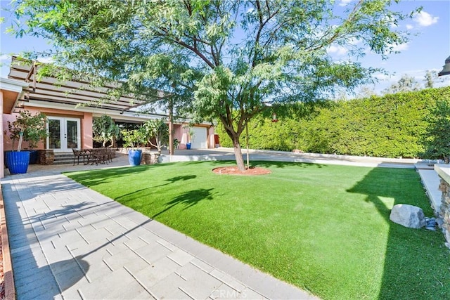 view of yard featuring french doors