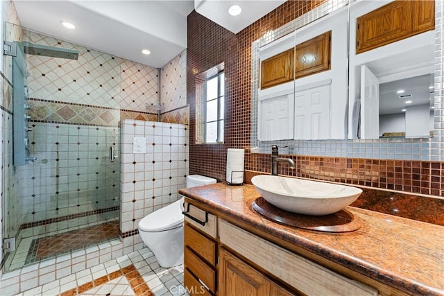 bathroom with walk in shower, tasteful backsplash, toilet, vanity, and tile walls