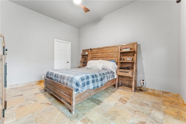 bedroom with ceiling fan and vaulted ceiling