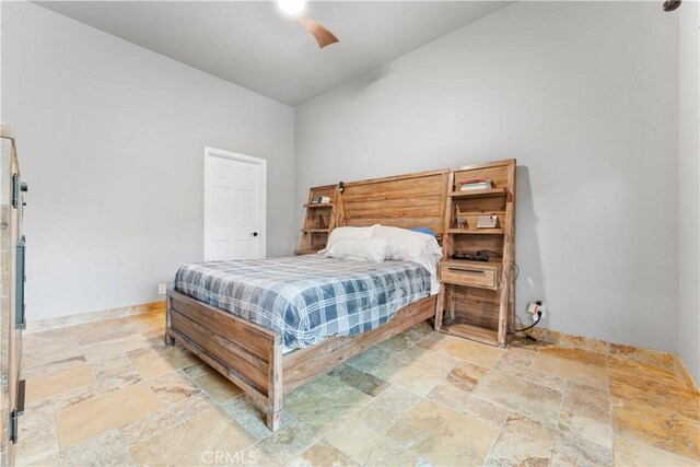 11431 Clybourn Ave, Lakeview Terrace, CA 91342 - bedroom featuring baseboards, stone finish flooring, and ceiling fan