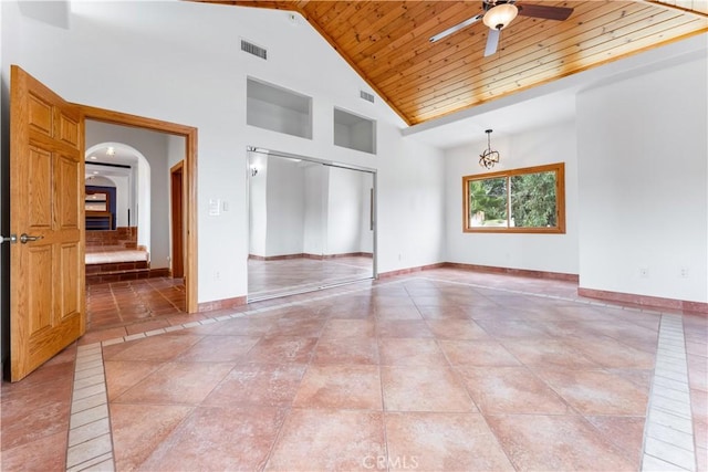 empty room with ceiling fan, tile patterned flooring, high vaulted ceiling, and wood ceiling