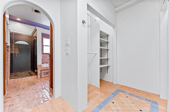 corridor featuring light tile patterned floors