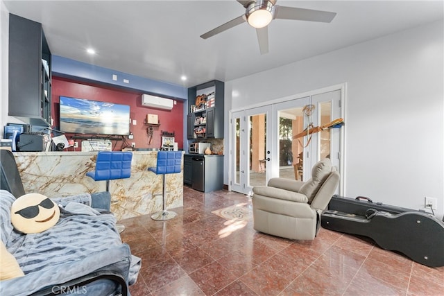 living room with a wall unit AC, ceiling fan, and french doors