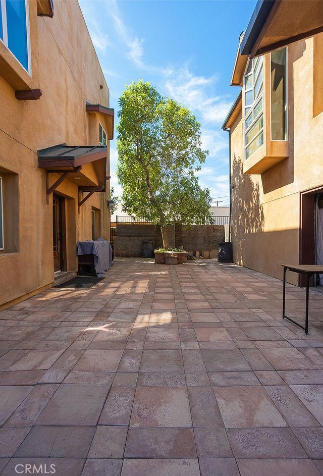 view of patio featuring fence