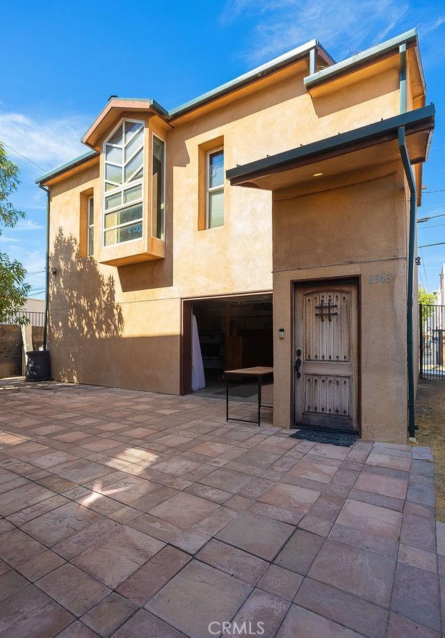 exterior space featuring a garage and a patio area