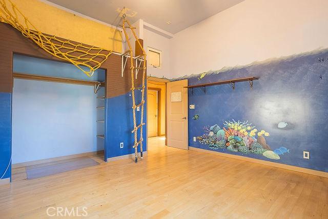 unfurnished bedroom with wood finished floors