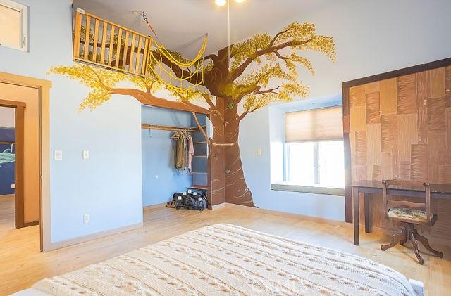 bedroom with wood finished floors