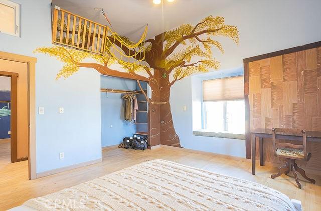 bedroom with wood finished floors