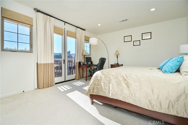 carpeted bedroom featuring access to outside