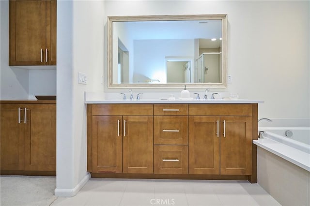 bathroom featuring shower with separate bathtub and vanity