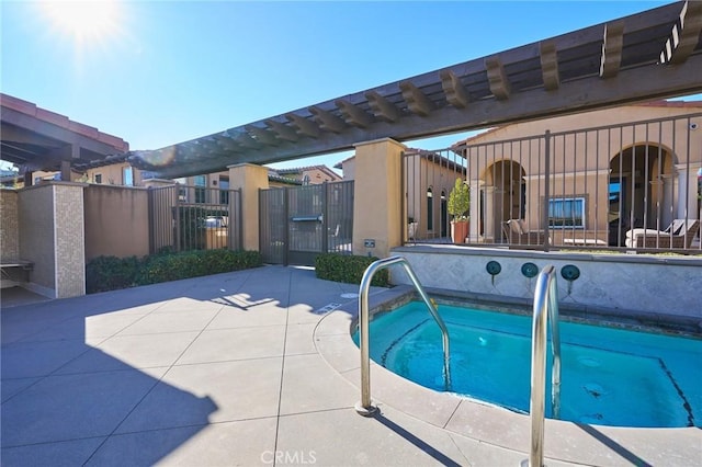 view of pool with a hot tub and a patio